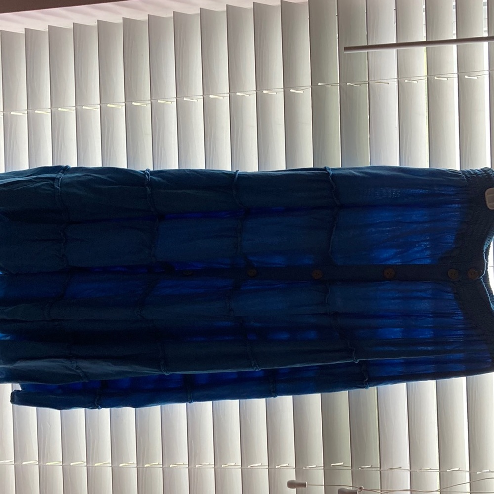 A blue flowy skirt with buttons